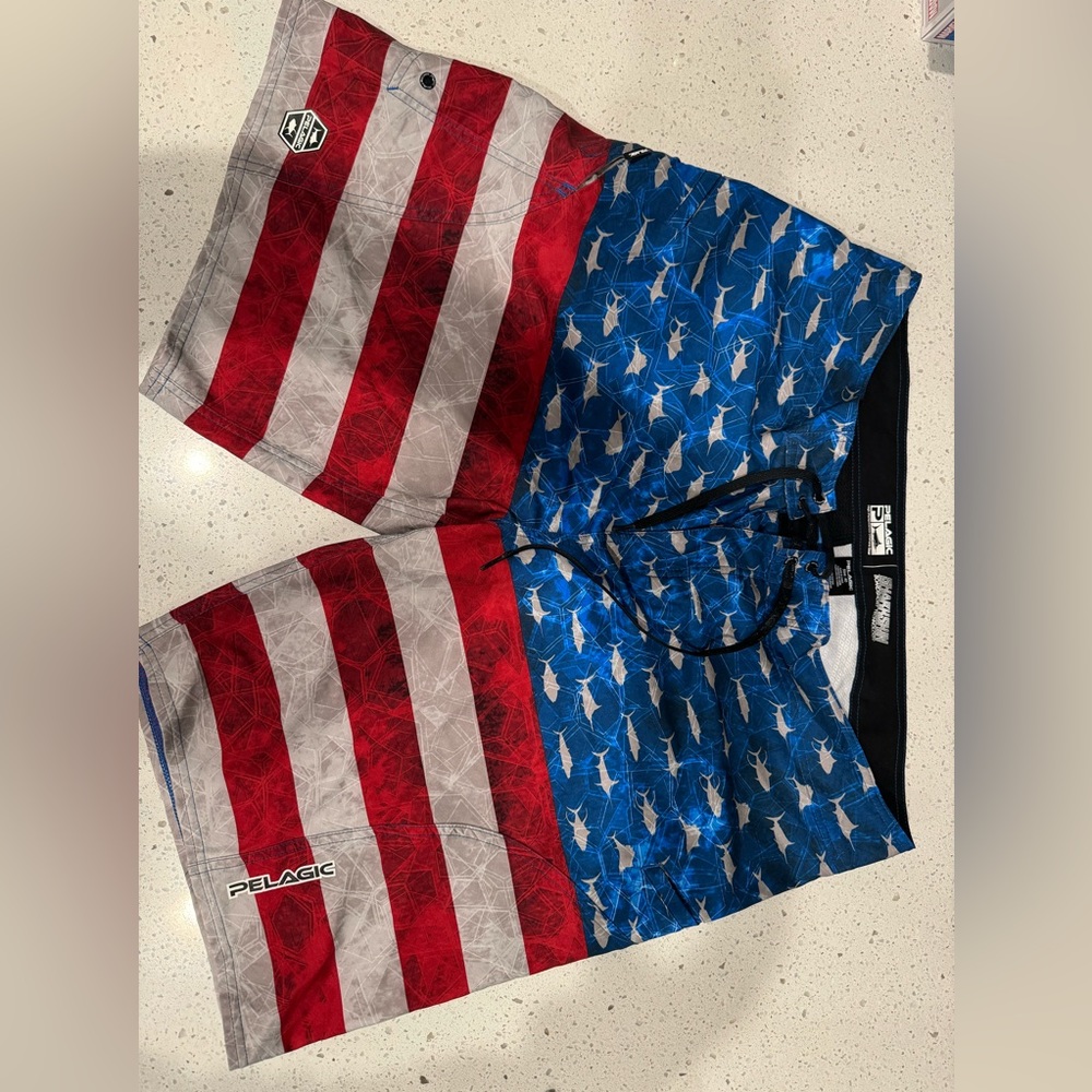 Pelagic Red, White, and Blue Swim Board Shorts